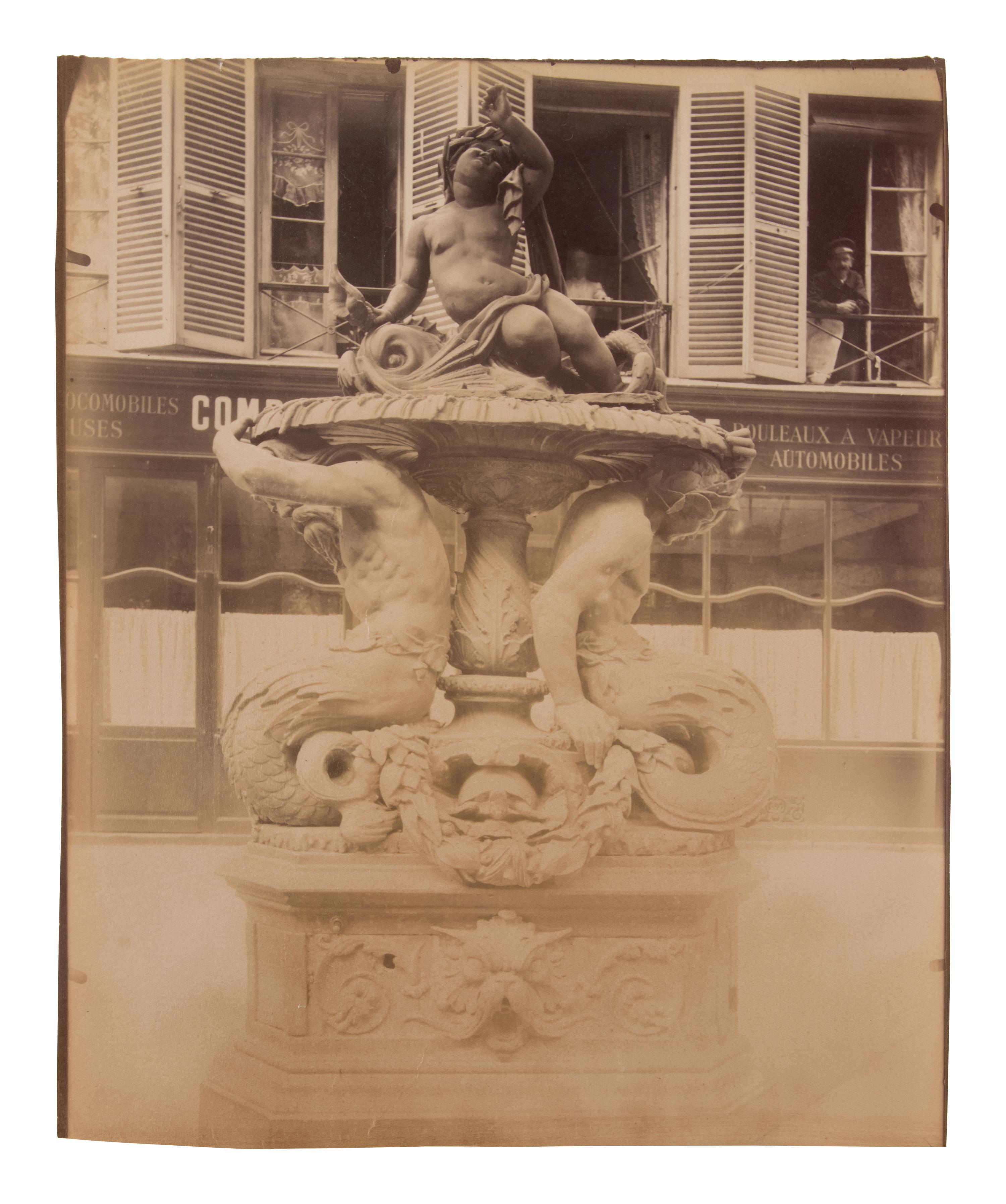 A group of four photographs ( Untitled [man at fountain], circa 1900s; Boutique empire, 14 rue de Grammont , 1903-1904; Hôtel de Neuville, rue Alphonse de Neuville, 1905-1906; Fontaine, faubourg Saint-Martin, 1912)