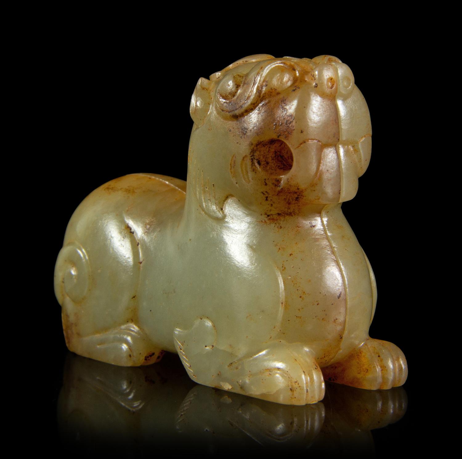 A Celadon and Russet Jade Mythical Beast