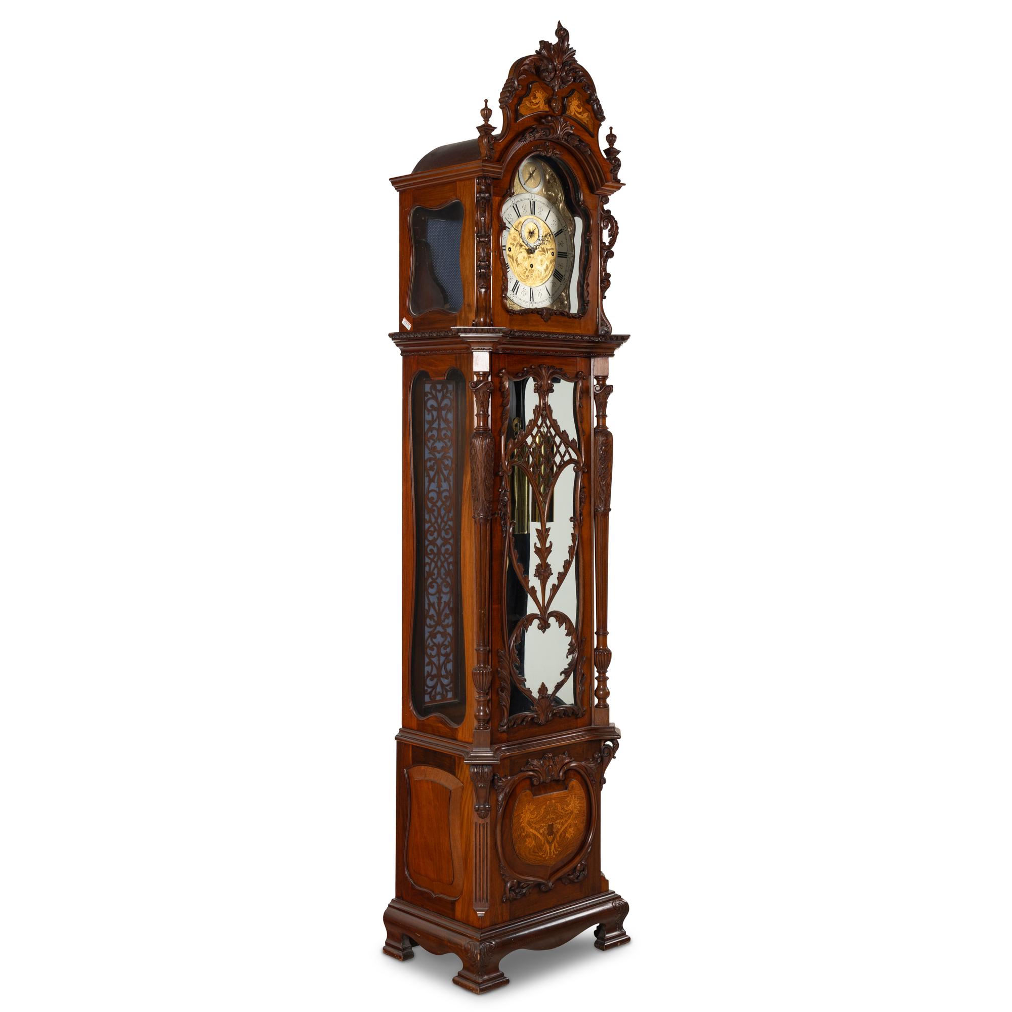 An English Carved Walnut Tall Case Clock