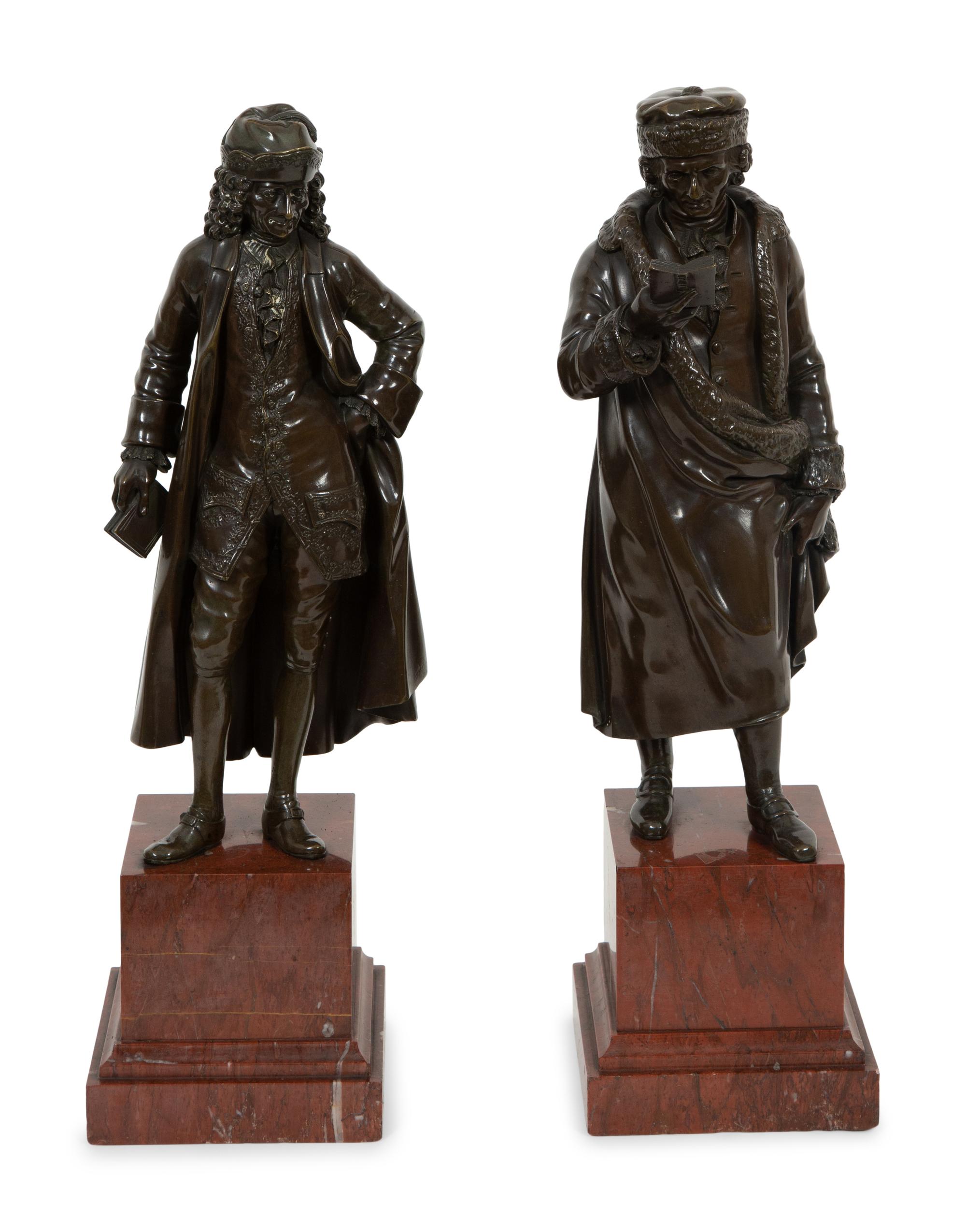 A Pair of Bronze Sculptures of Voltaire and Rousseau