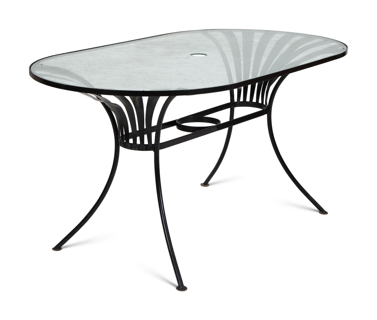 A Spring Steel Garden Table and Eight Chairs by Francois Carre