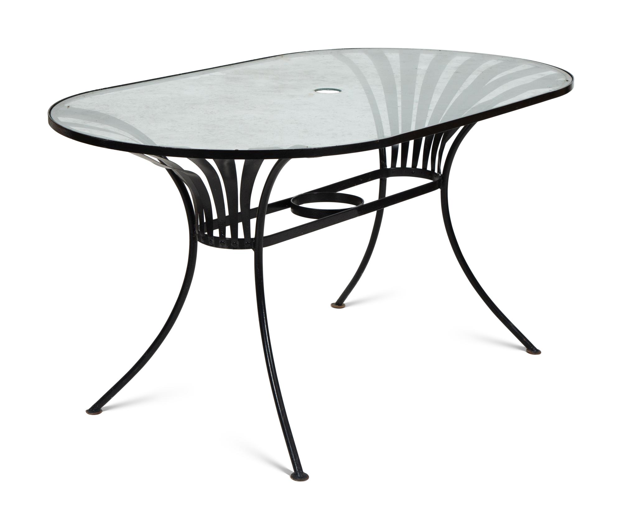 A Spring Steel Garden Table and Eight Chairs by Francois Carre