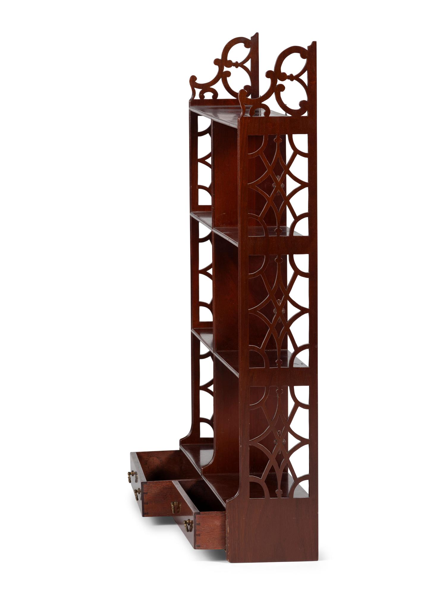 A Chippendale Style Carved and Figured Mahogany Hanging Plate Rack