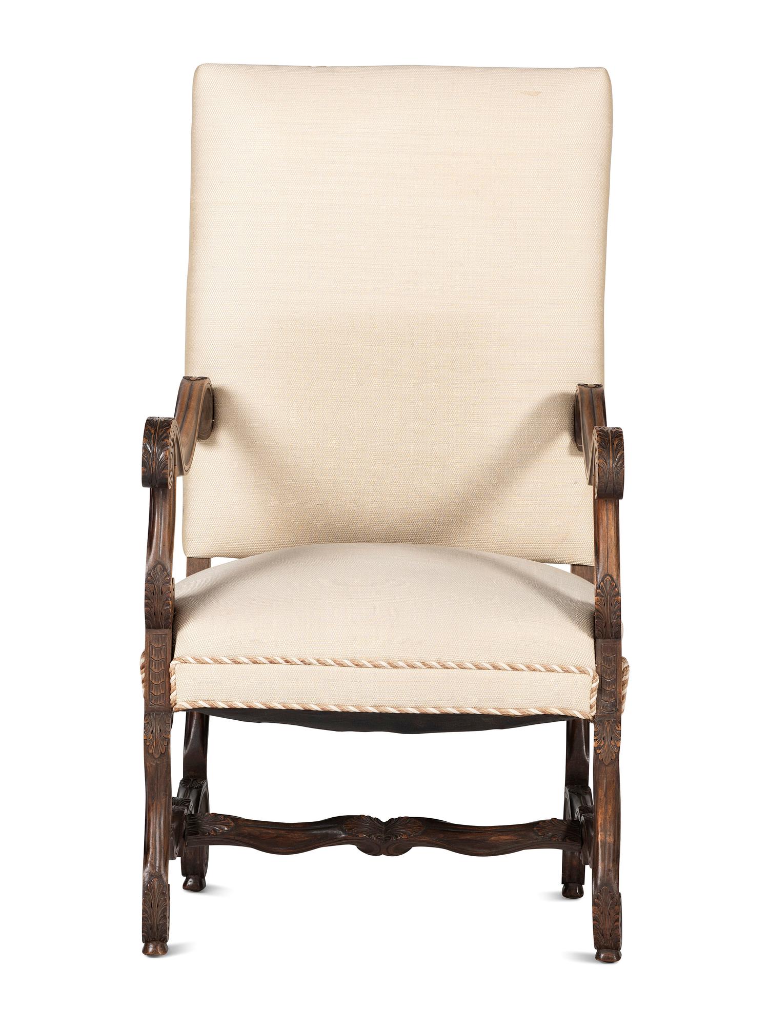 A Louis XIV Style Foliate and Scroll Carved Walnut Upholstered Fauteuil