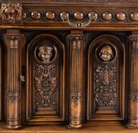 A Renaissance Revival Carved Walnut Marble-Top Cabinet