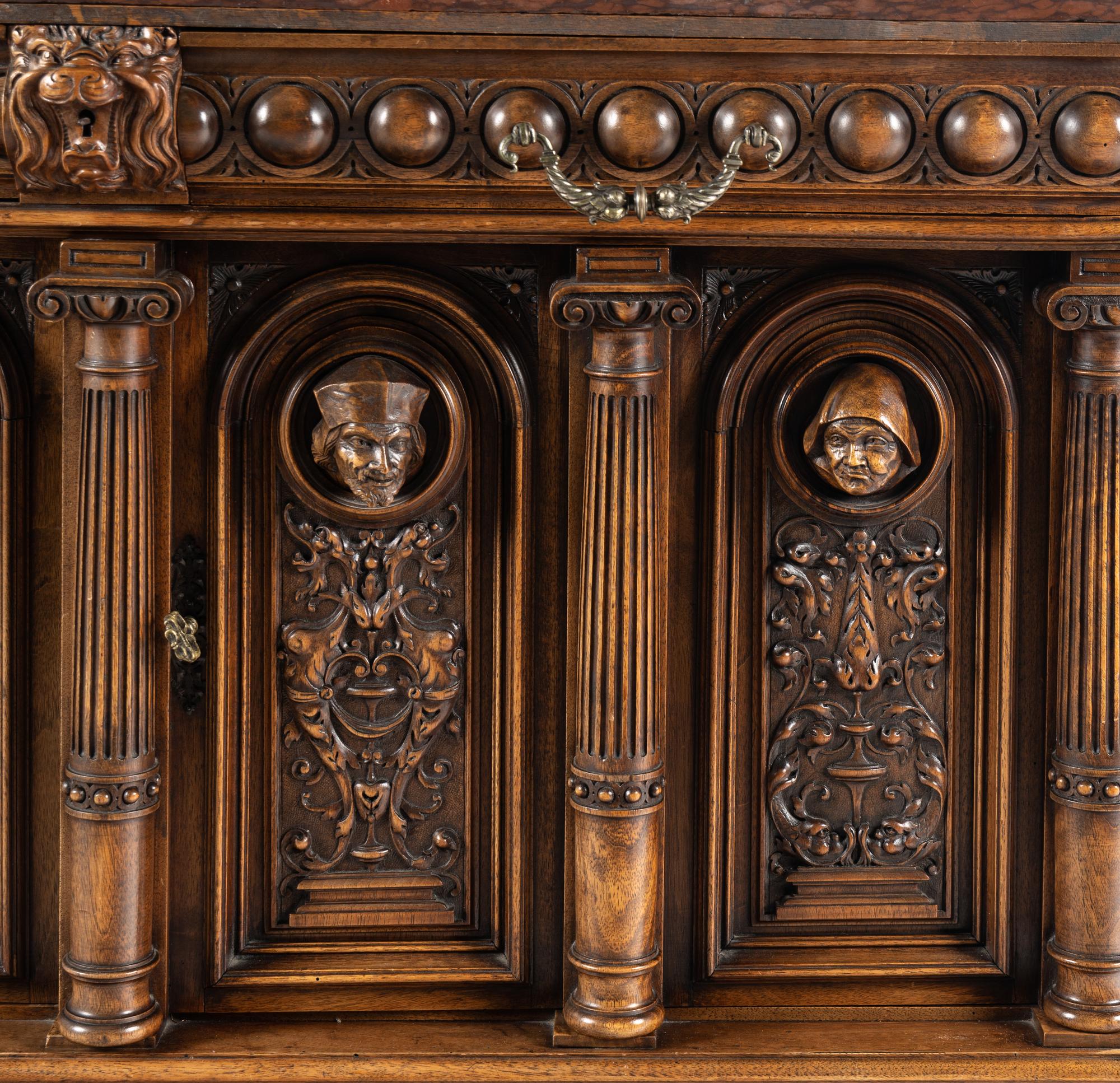 A Renaissance Revival Carved Walnut Marble-Top Cabinet