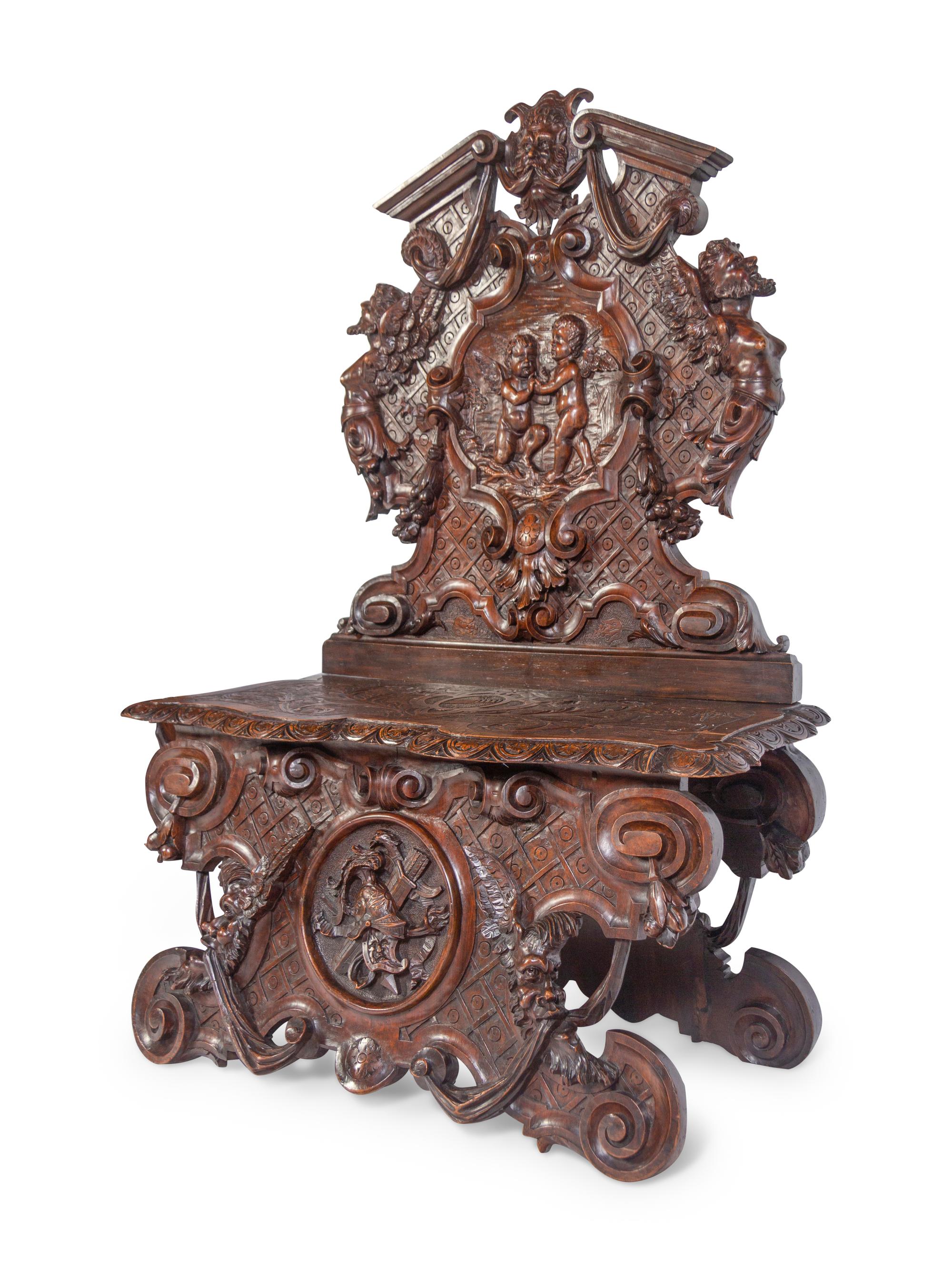 A Pair of Italian Baroque Style Carved Walnut Benches