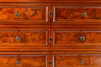 An Italian Walnut Chest of Drawers