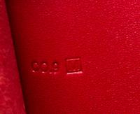 An Hermes Rouge Leather Passport Pouch, 7" x 8" x 1".