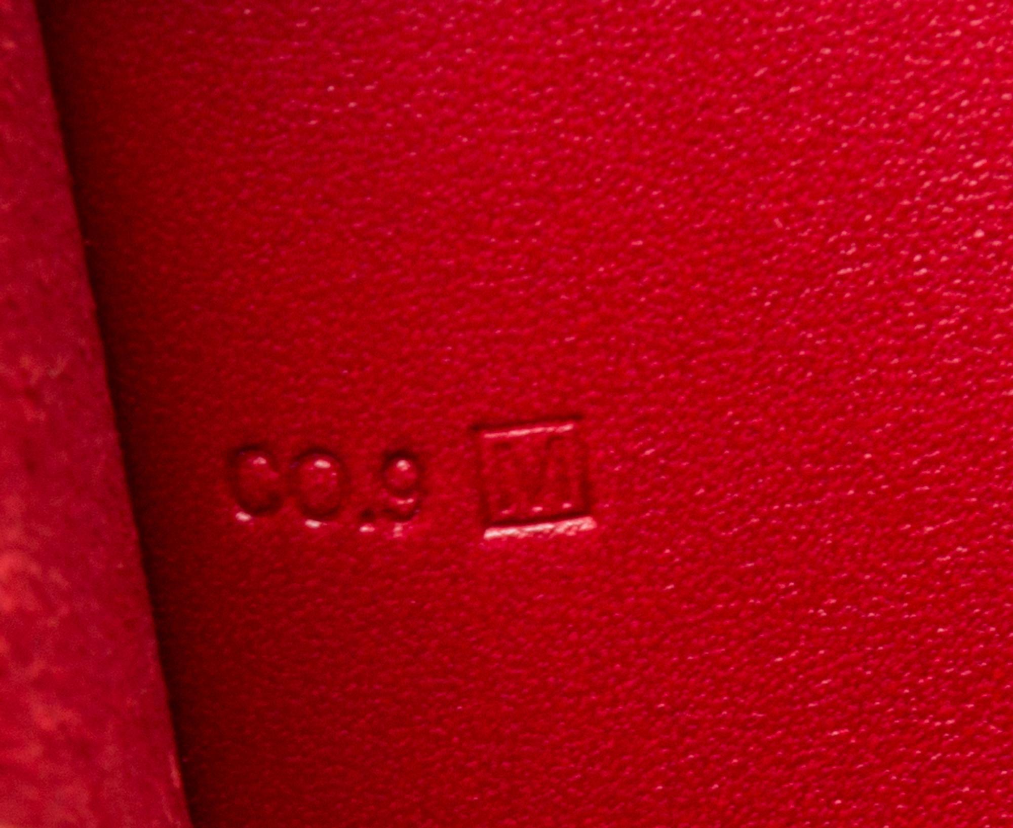 An Hermes Rouge Leather Passport Pouch, 7" x 8" x 1".