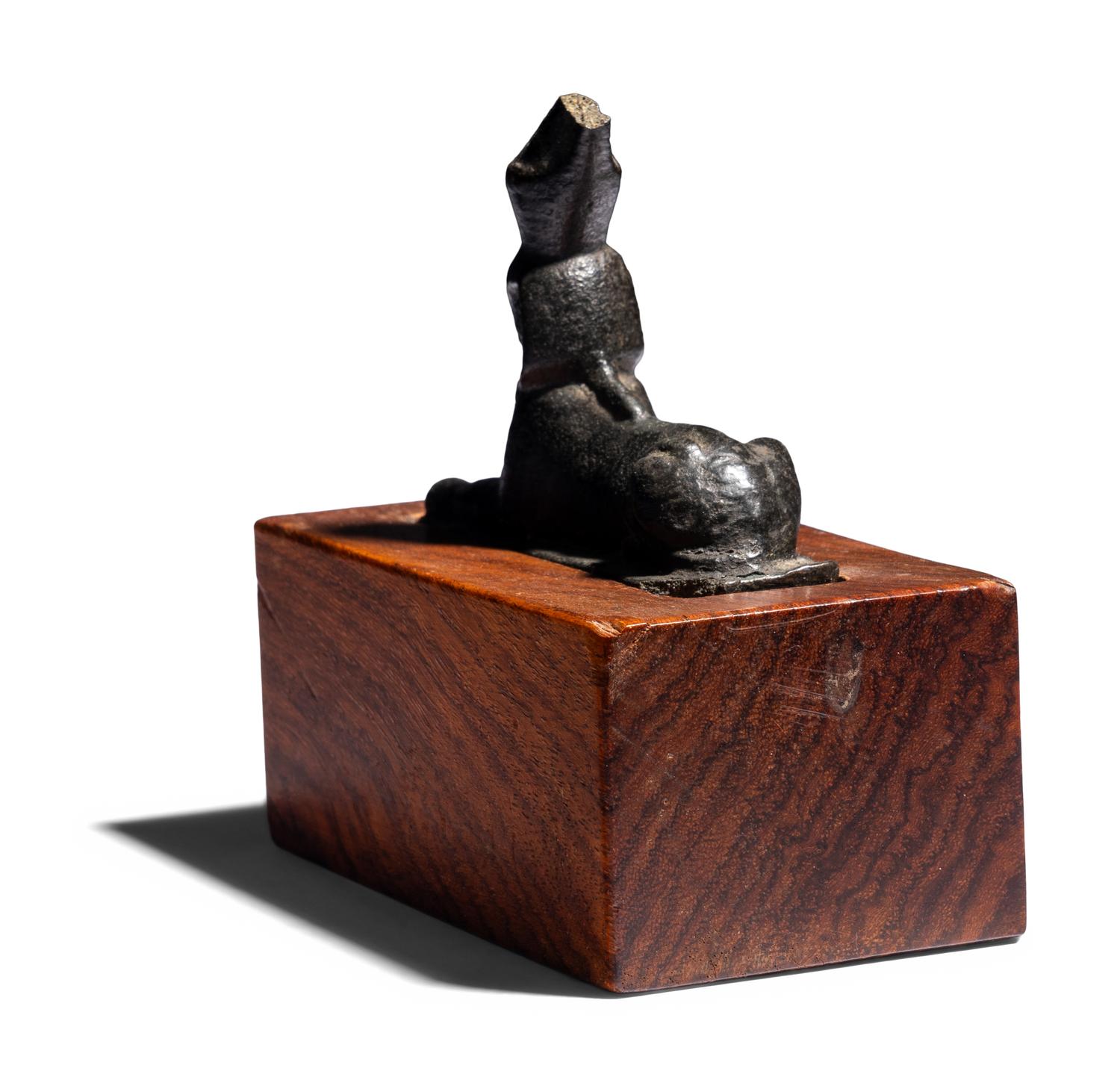 An Egyptian Bronze Sphinx