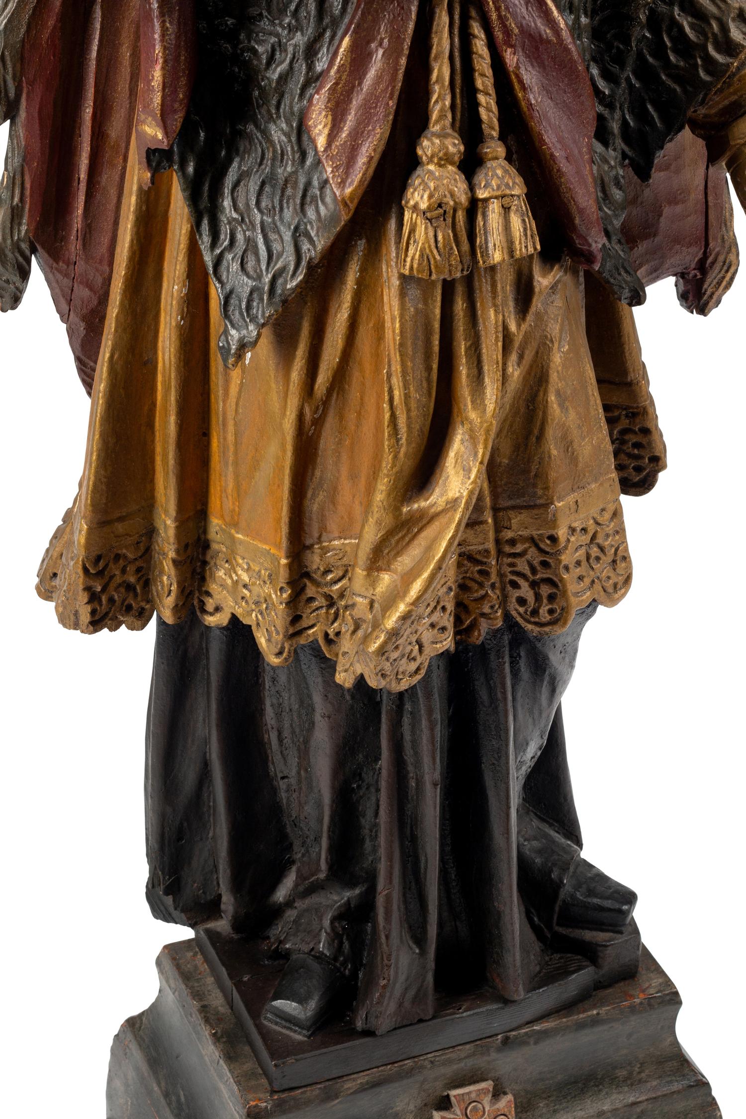 An Italian Carved and Painted Saint Figure and Stand