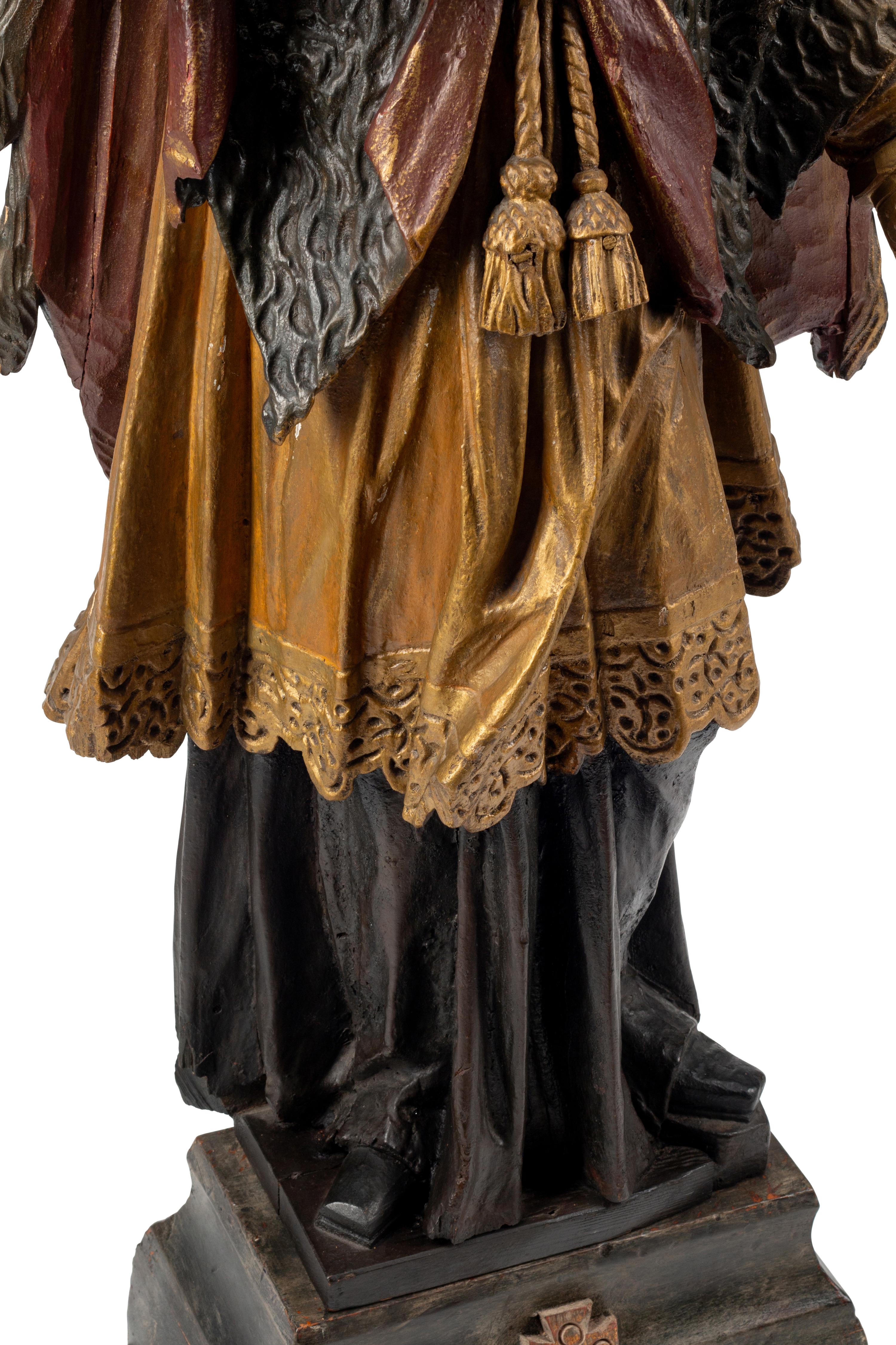 An Italian Carved and Painted Saint Figure and Stand