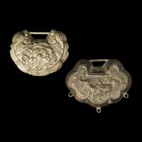 A Chinese Silver Necklace and Eight Chinese Silver Ruyi Lock-Form Pendants, Qing Dynasty 清 銀項圈一及銀如意頭形長命鎖一組八件