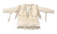 A Southern Cheyenne Hide Shirt Length 29 inches. — CIRCA 1930