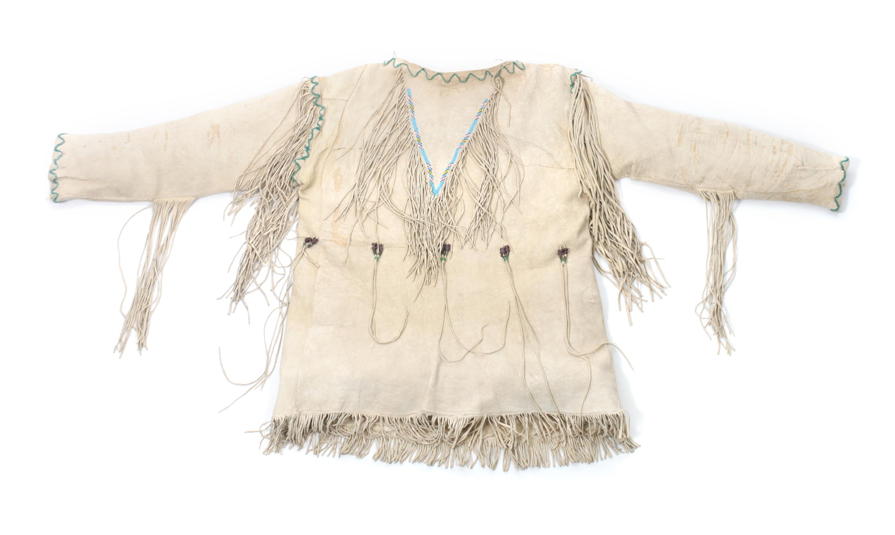 A Southern Cheyenne Hide Shirt Length 29 inches. — CIRCA 1930