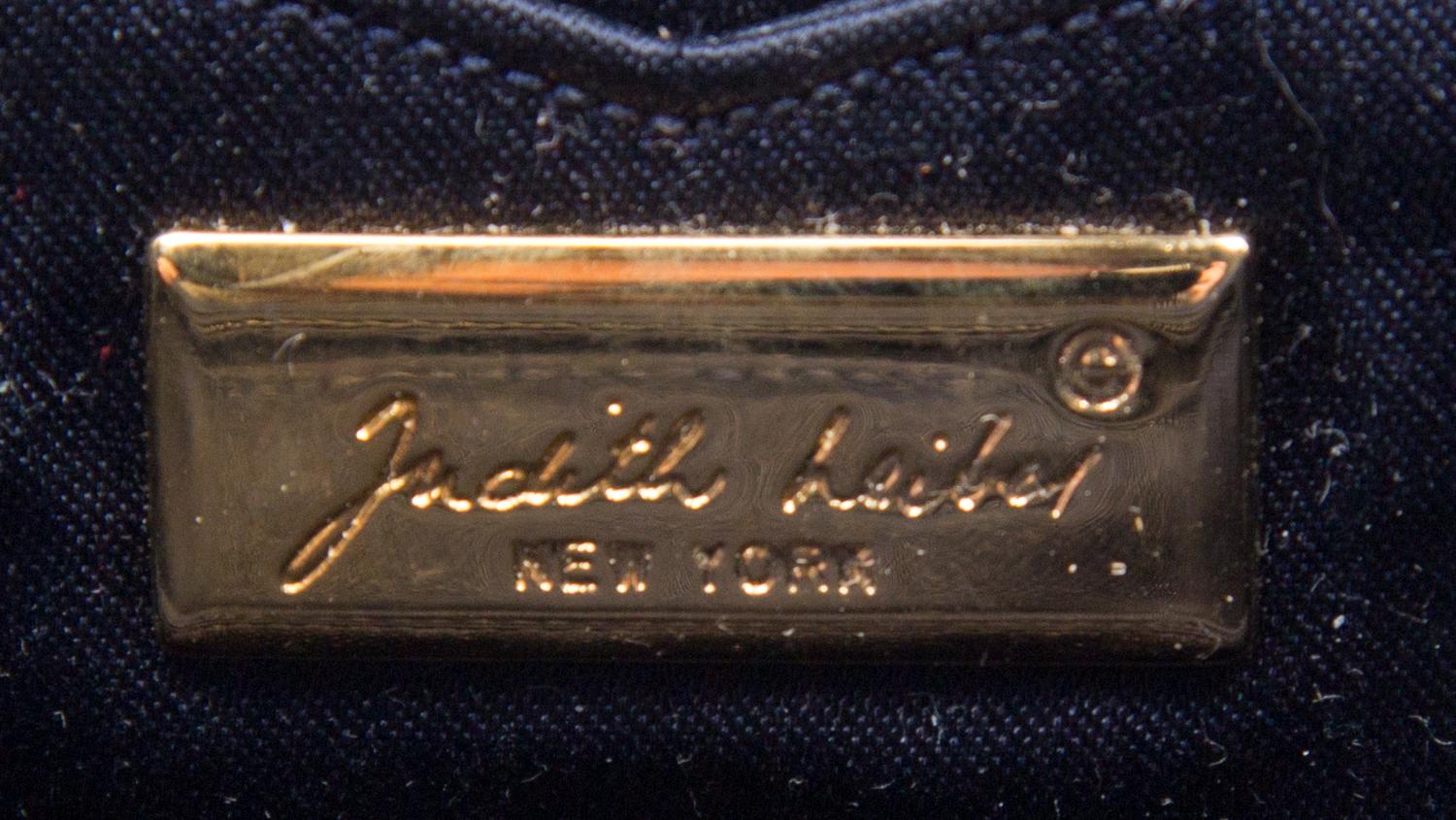 A Judith Leiber Navy Nylon Clutch, 6.5" x 3.5" x 1".