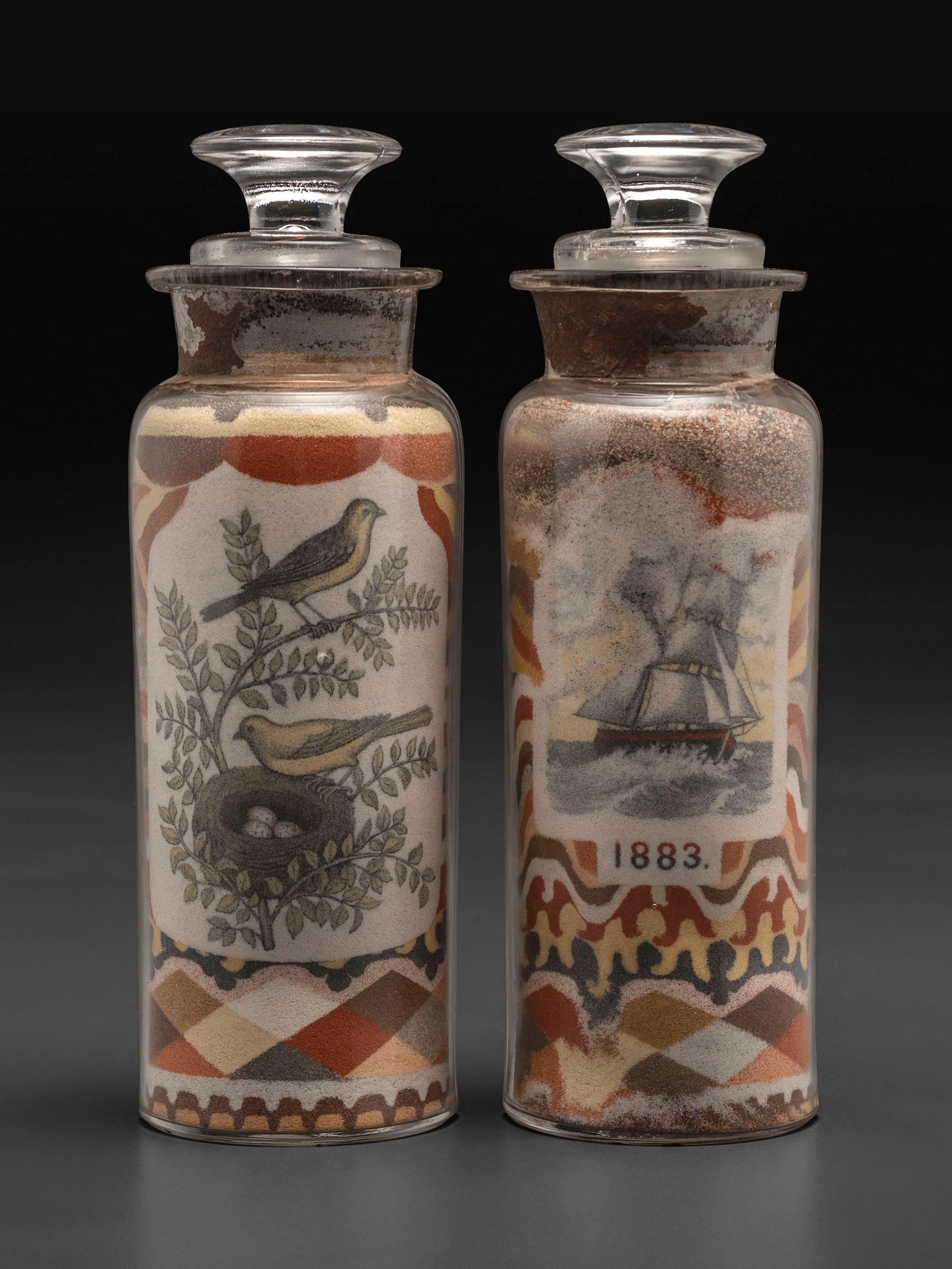 A Pair of Andrew Clemens (American, 1857-1894) 'Sweetheart' Sand Bottles