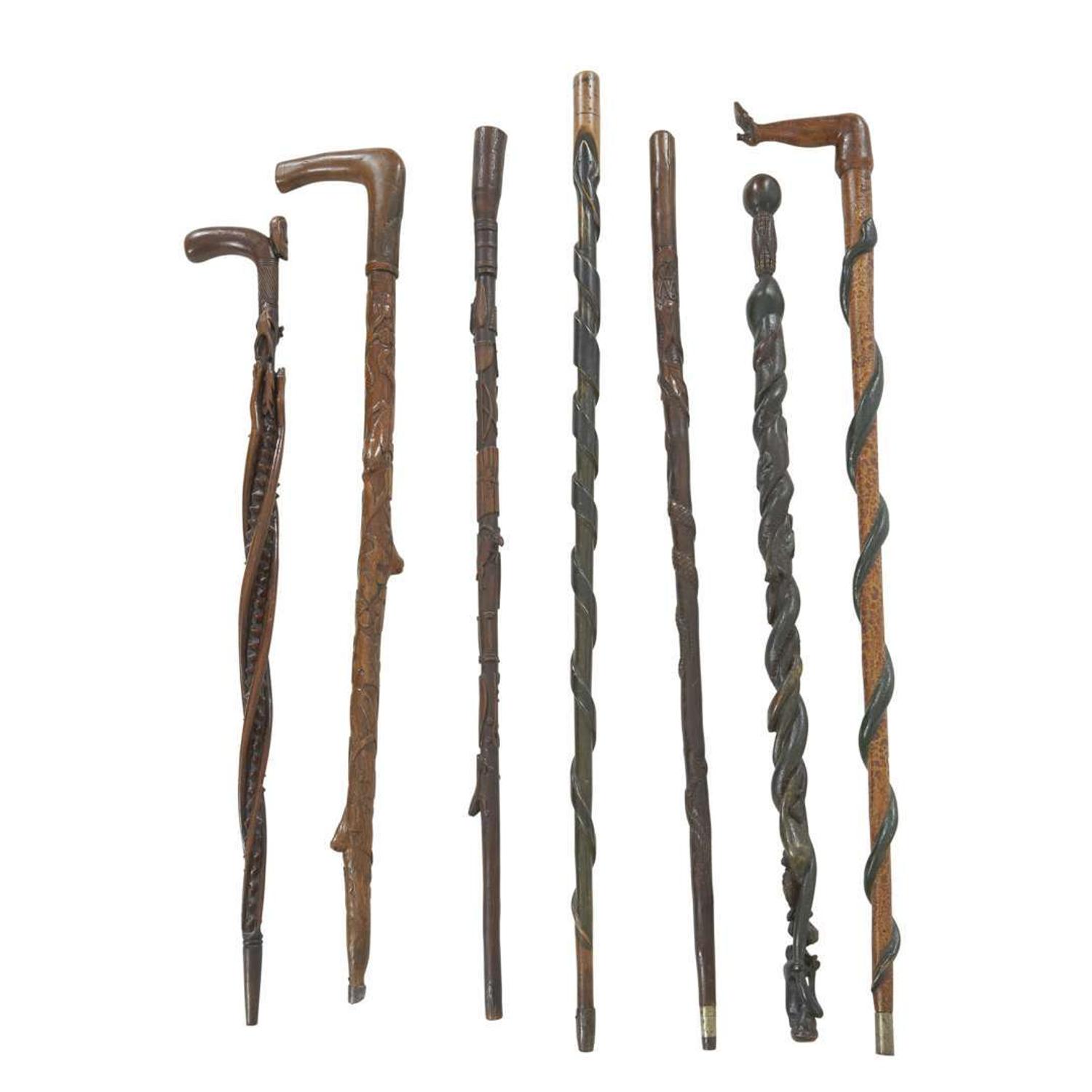 Group of seven carved and painted canes late 19th/early 20th century