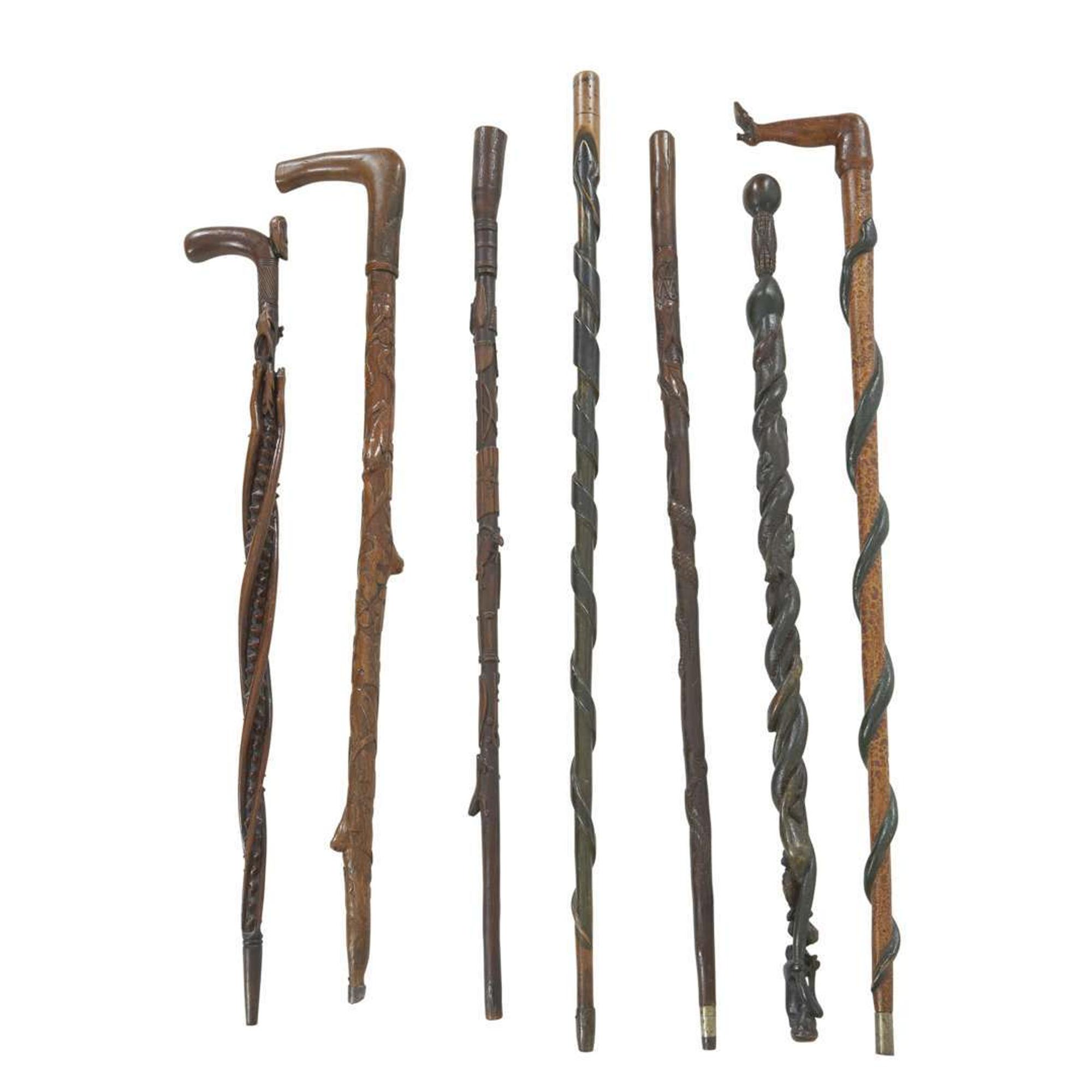 Group of seven carved and painted canes late 19th/early 20th century