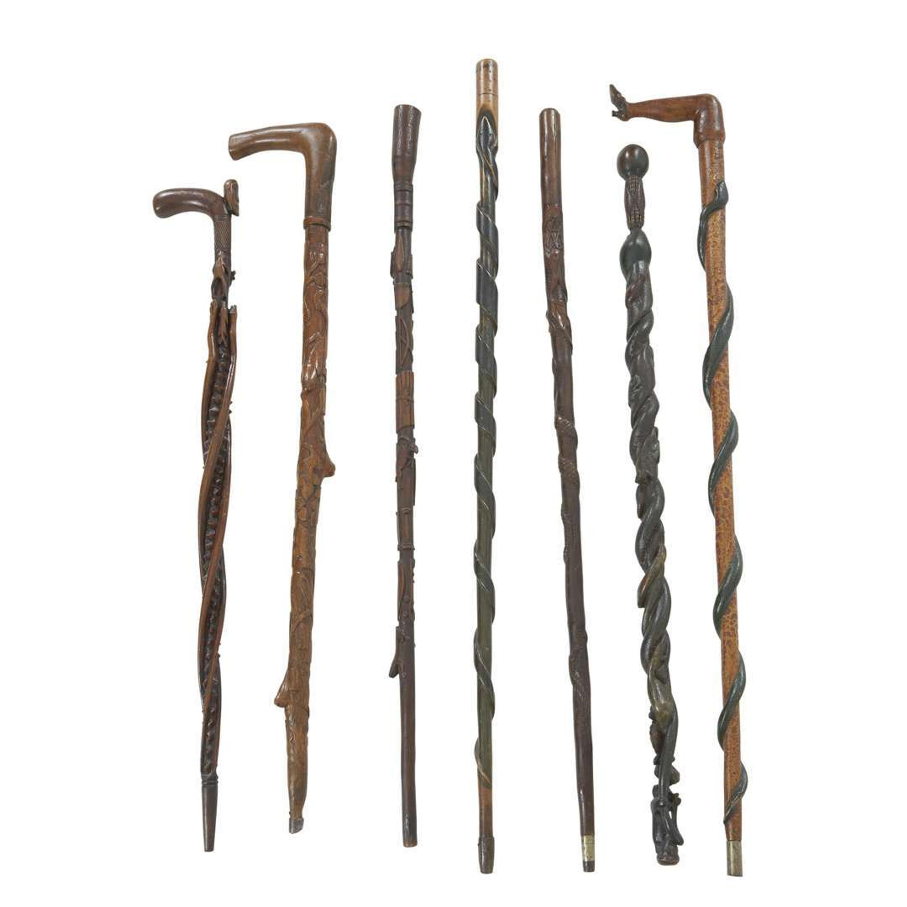 Group of seven carved and painted canes late 19th/early 20th century