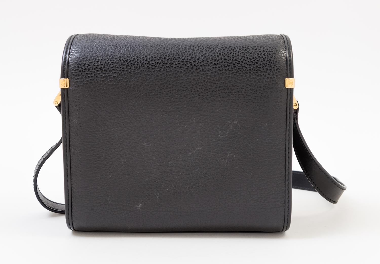A Gucci Black Leather Camera Bag, 7" x 6" x 4"; Strap drop: 23".