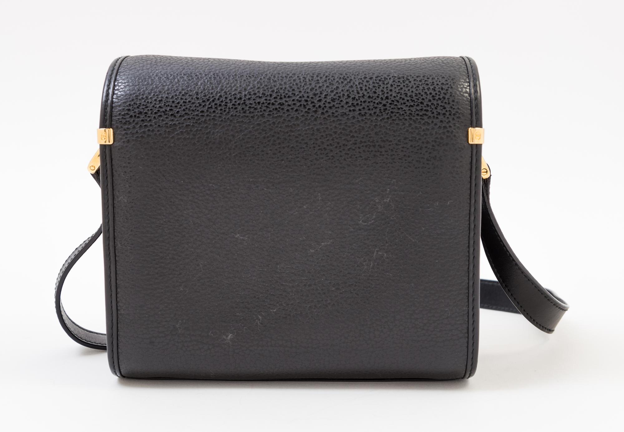 A Gucci Black Leather Camera Bag, 7" x 6" x 4"; Strap drop: 23".