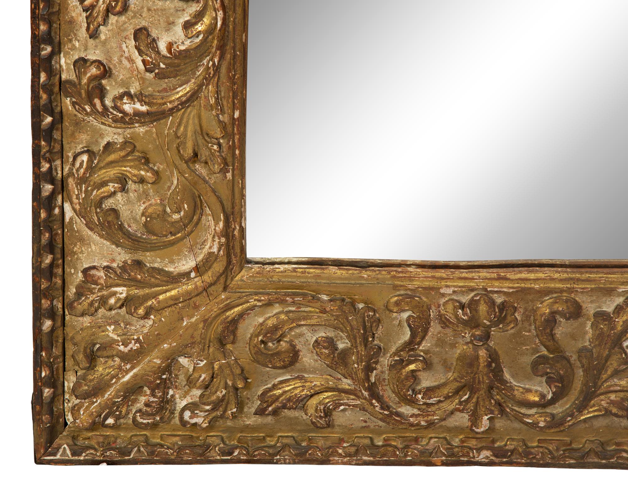 A Continental Rococo Style Foliate Carved Giltwood Framed Floor Mirror — 18TH/19TH CENTURY