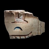 An Egyptian Painted Limestone Relief Fragment