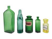 A Group of Green Glass Apothecary Bottles