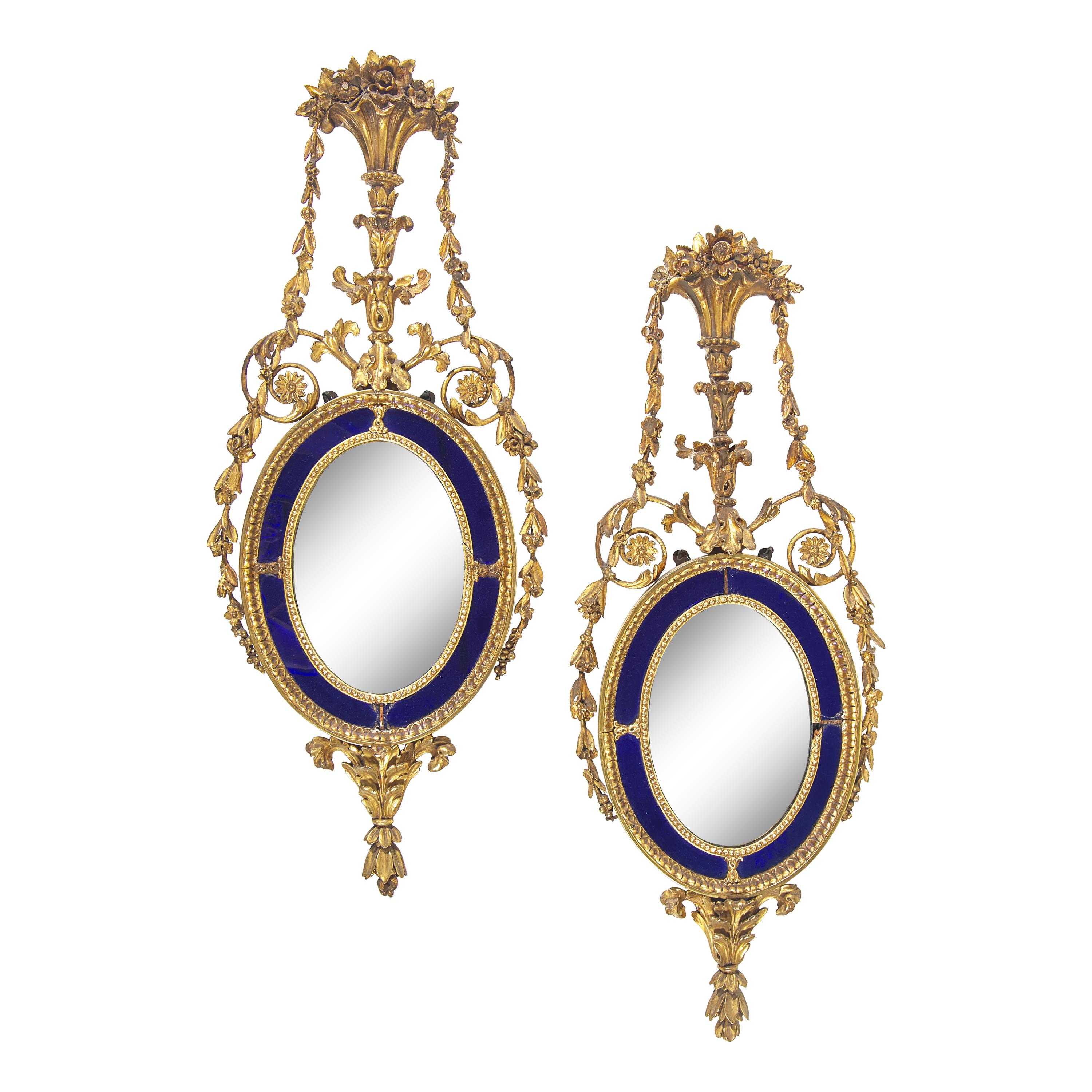 A Pair of Neoclassical Cobalt Glass-Inset and Giltwood Mirrors