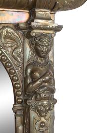 A Renaissance Revival Pressed Brass Mirror