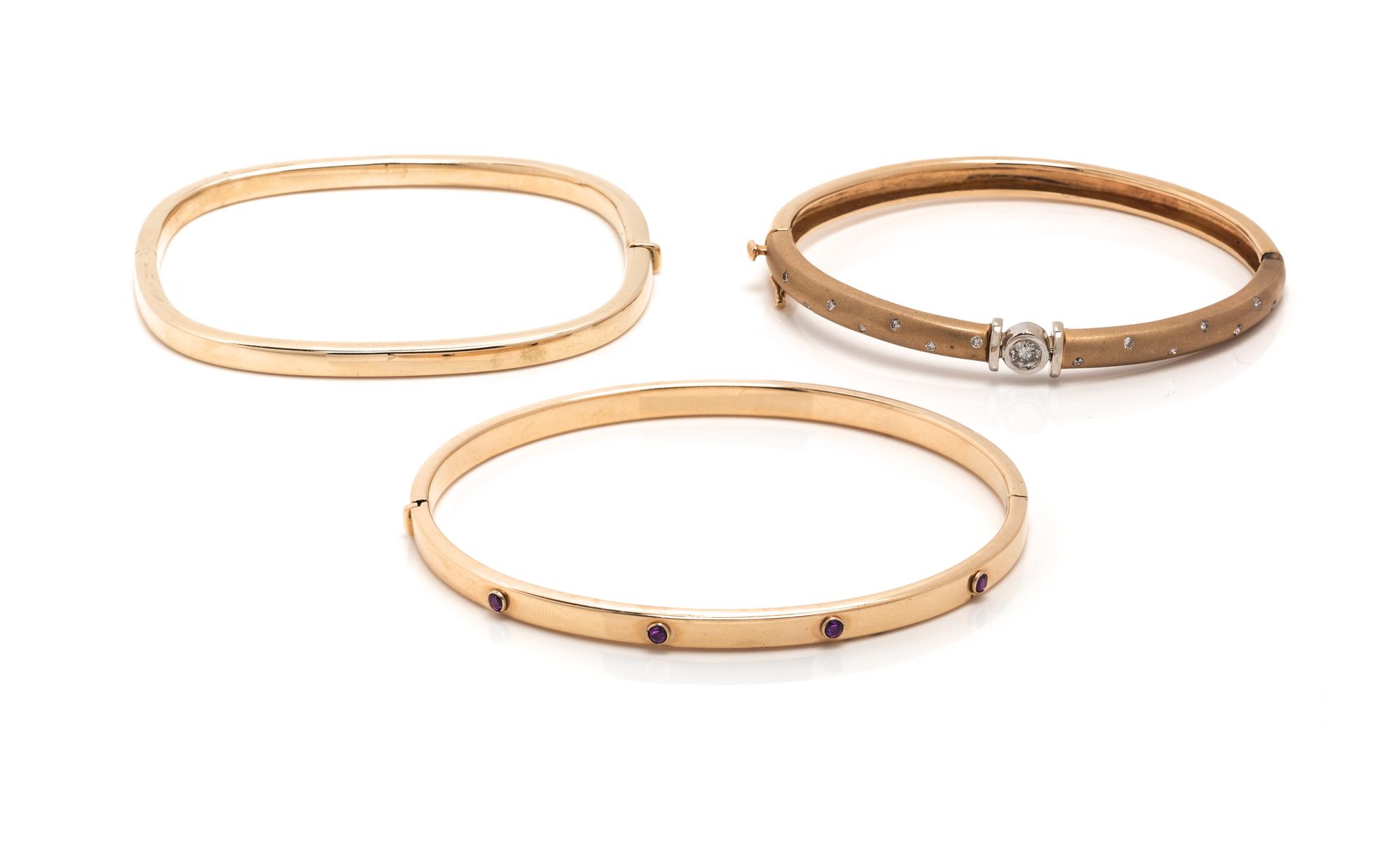 COLLECTION OF YELLOW GOLD BANGLE BRACELETS