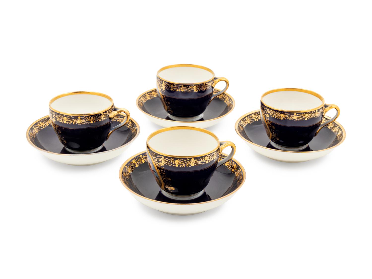 A Set of Four Berlin (K.P.M.) Parcel Gilt Cobalt Ground Porcelain Teacups and Saucers