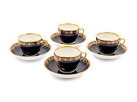 A Set of Four Berlin (K.P.M.) Parcel Gilt Cobalt Ground Porcelain Teacups and Saucers