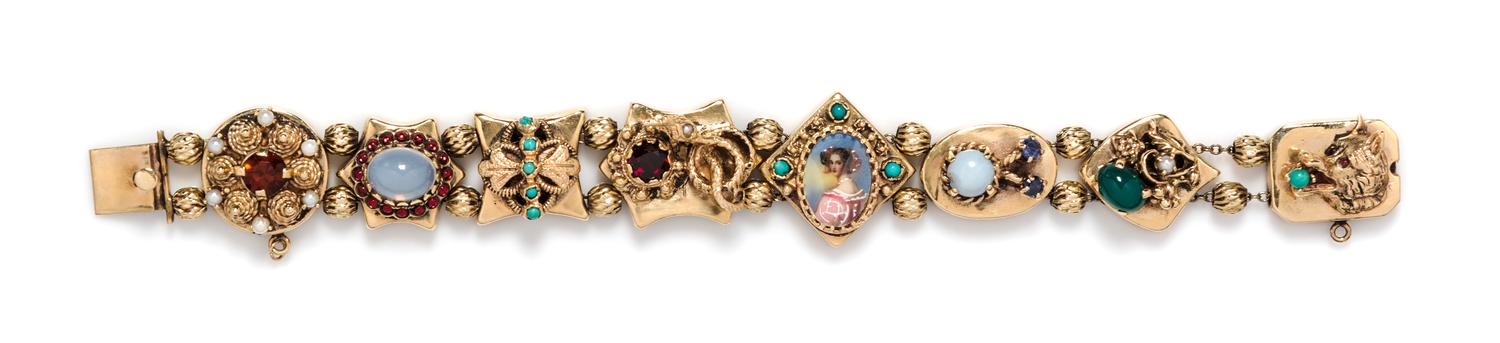 A Vinage 14 Karat Yellow Gold and Multi Gem Charm Slide Bracelet, 28.90 dwts.