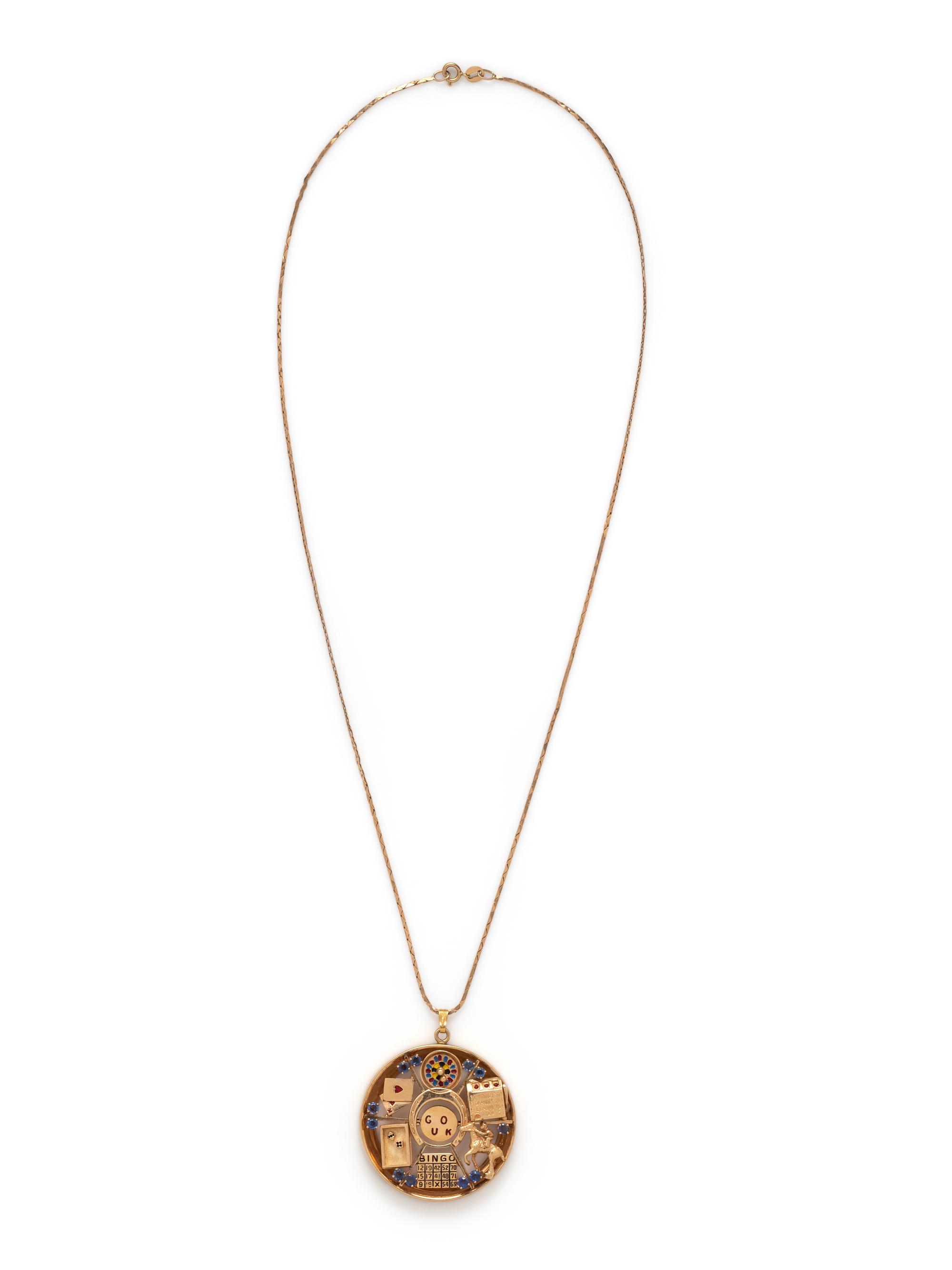 RETRO, YELLOW GOLD, SAPPHIRE AND ENAMEL 'GOOD LUCK' PENDANT/NECKLACE