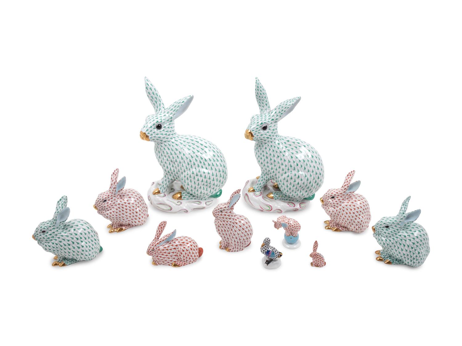 Nine Herend Painted and Parcel Gilt Porcelain Rabbits