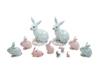 Nine Herend Painted and Parcel Gilt Porcelain Rabbits