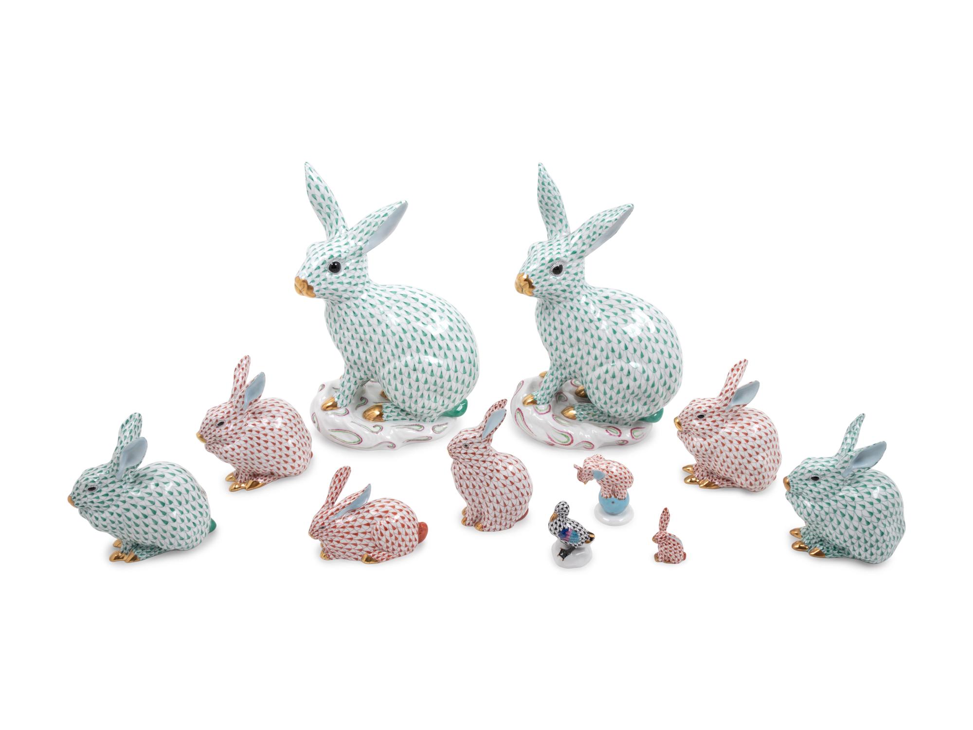 Nine Herend Painted and Parcel Gilt Porcelain Rabbits