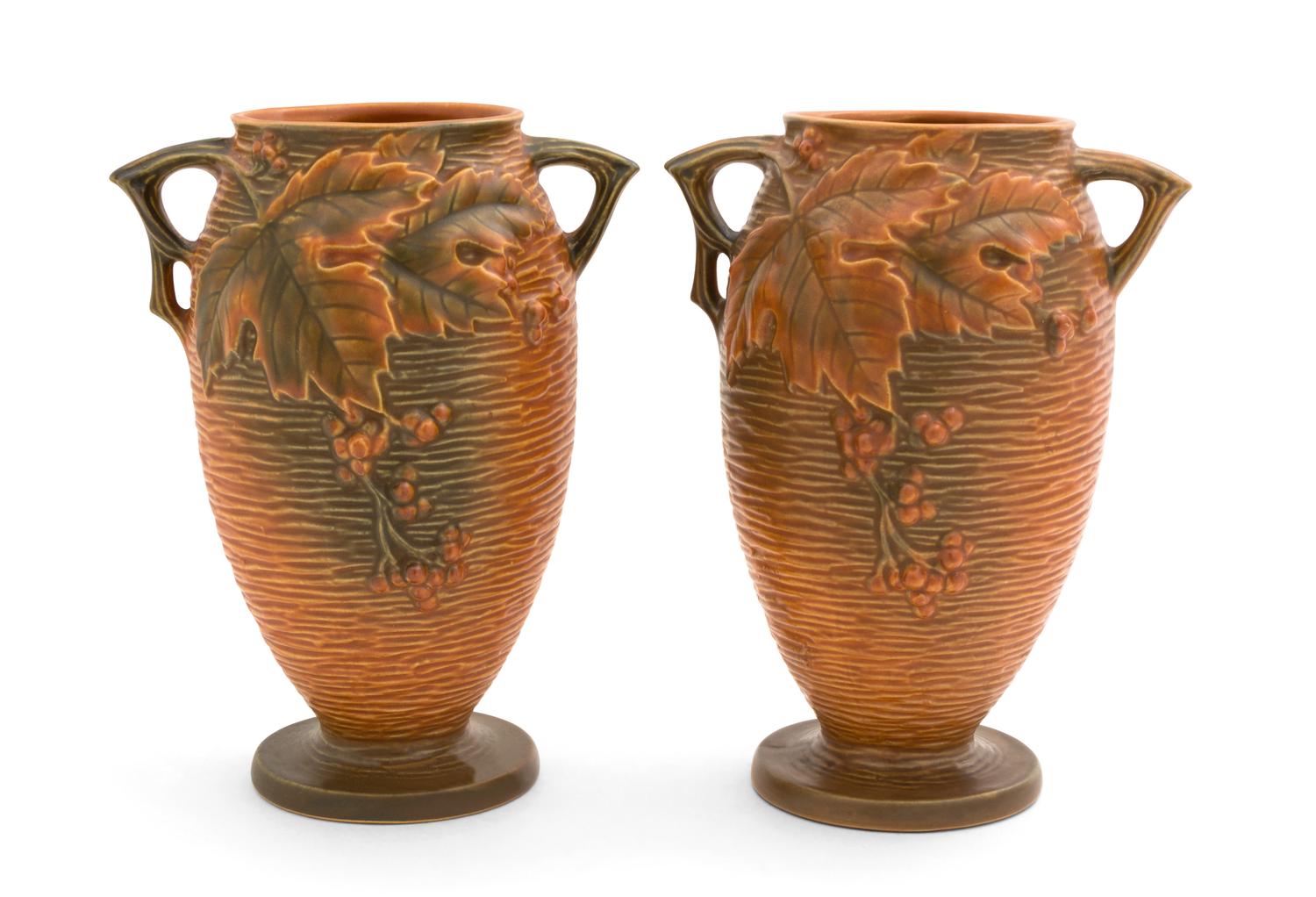 A Pair of Roseville Bushberry Pottery Vases Height 9 1/4 inches.