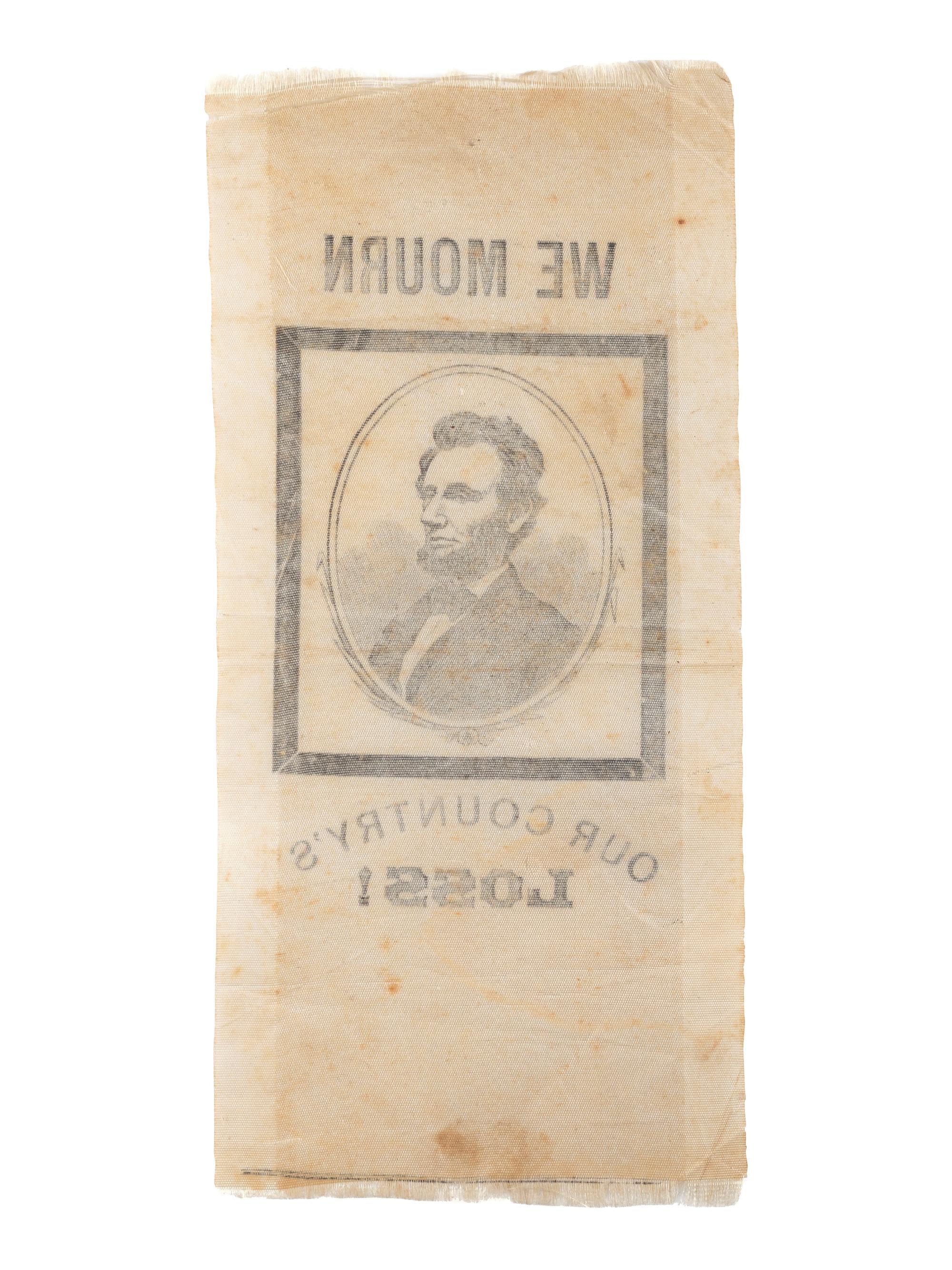[LINCOLN, Abraham (1809-1865)]. Silk ribbon mourning the loss of Lincoln. [ With: ] Newspapers containing coverage of Lincoln's presidency.