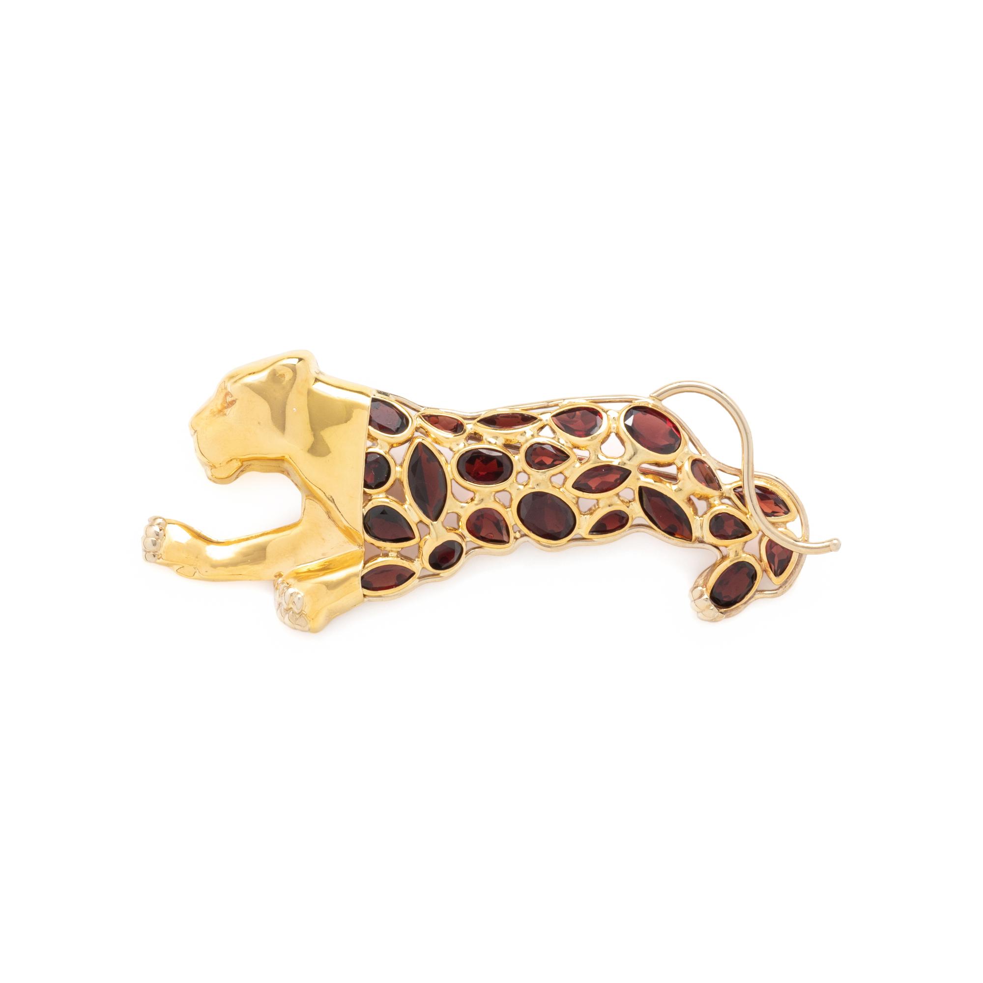 YELLOW GOLD AND GARNET LEOPARD BROOCH