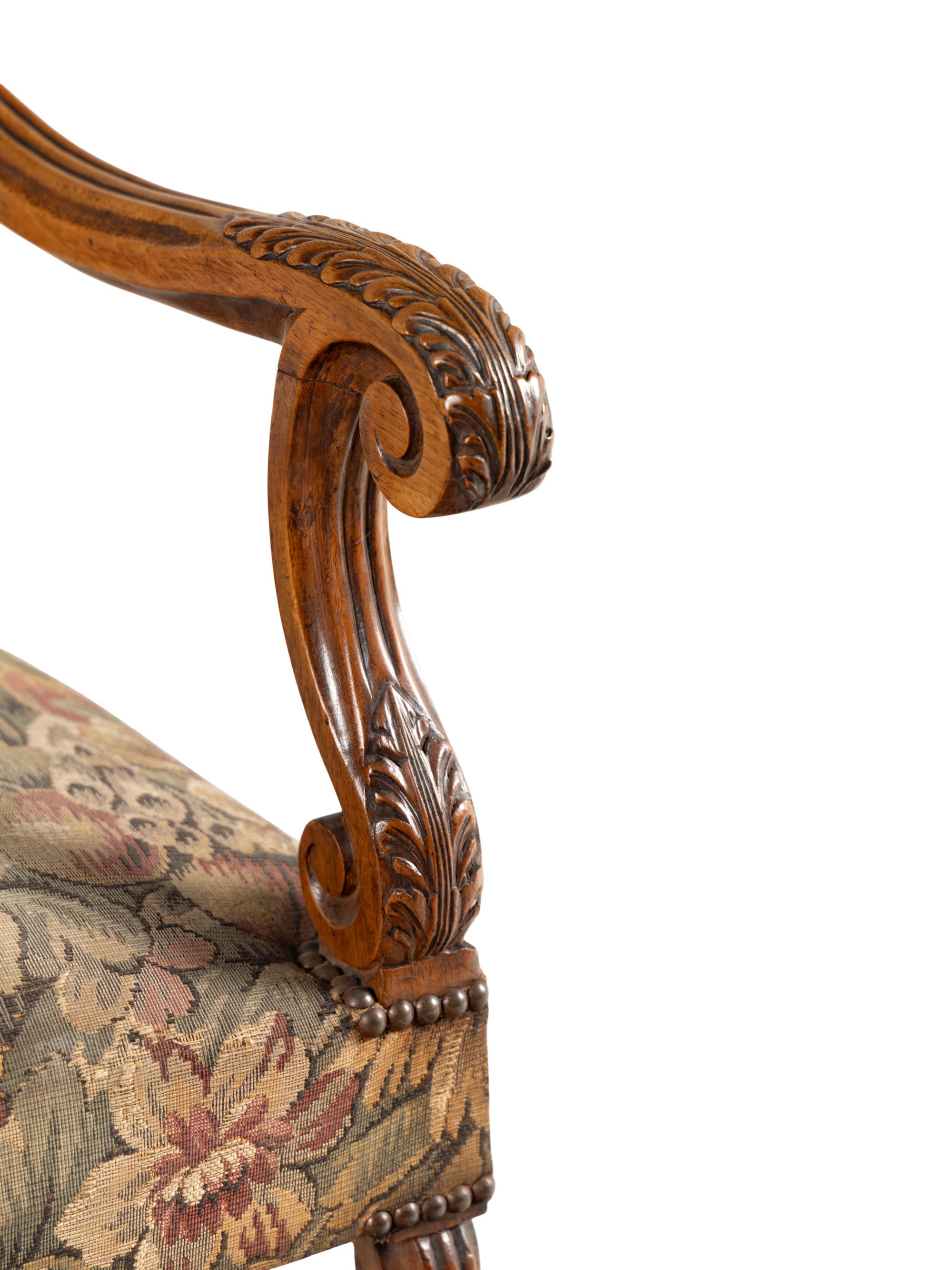 A Louis XIII Style Carved Walnut Armchair