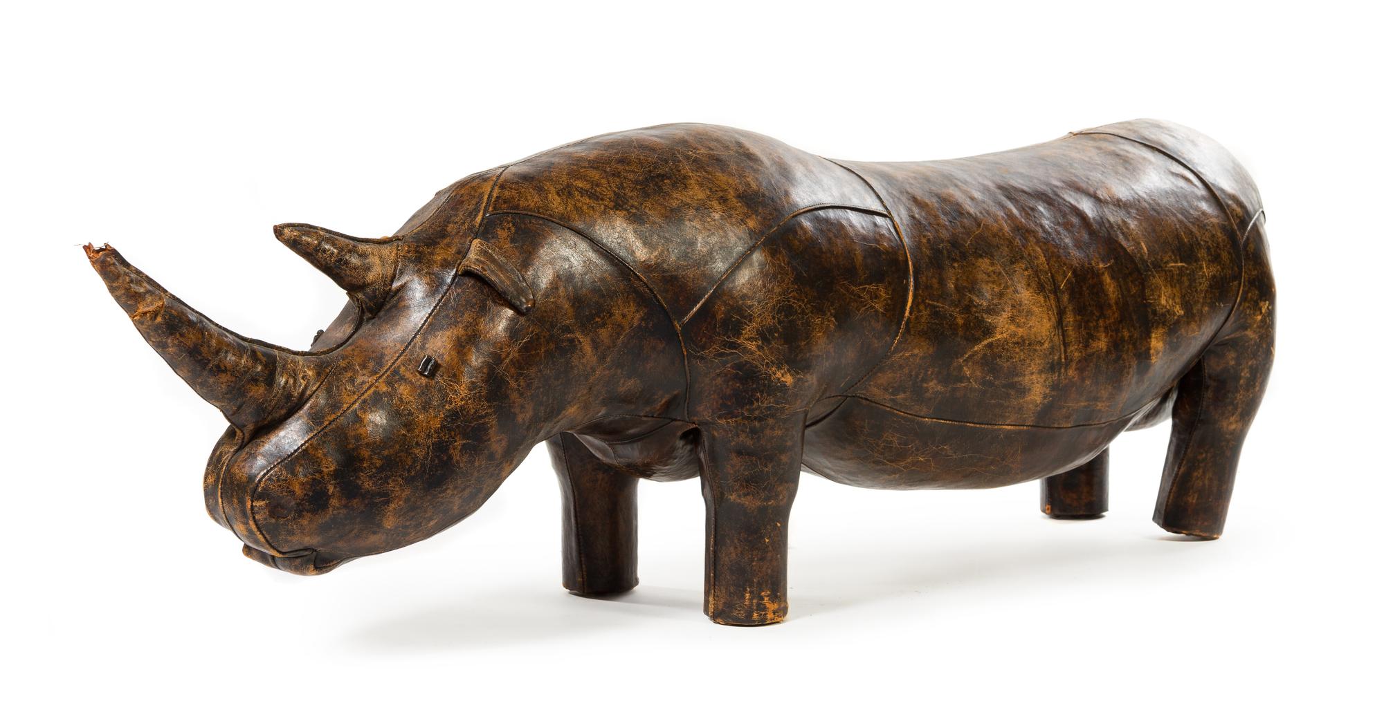 A Leather-Clad Rhinoceros Footstool Height 24 x width 77 x depth 15 inches. — DIMITRI OMERSA FOR ABERCROMBIE & FITCH, CIRCA 1960s