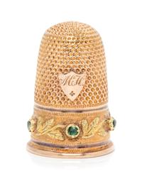 A French 18-Karat Bi-Color Gold and Emerald Thimble, Paris, Late 19th/Early 20th Century, the knurled top and body above the foliate de