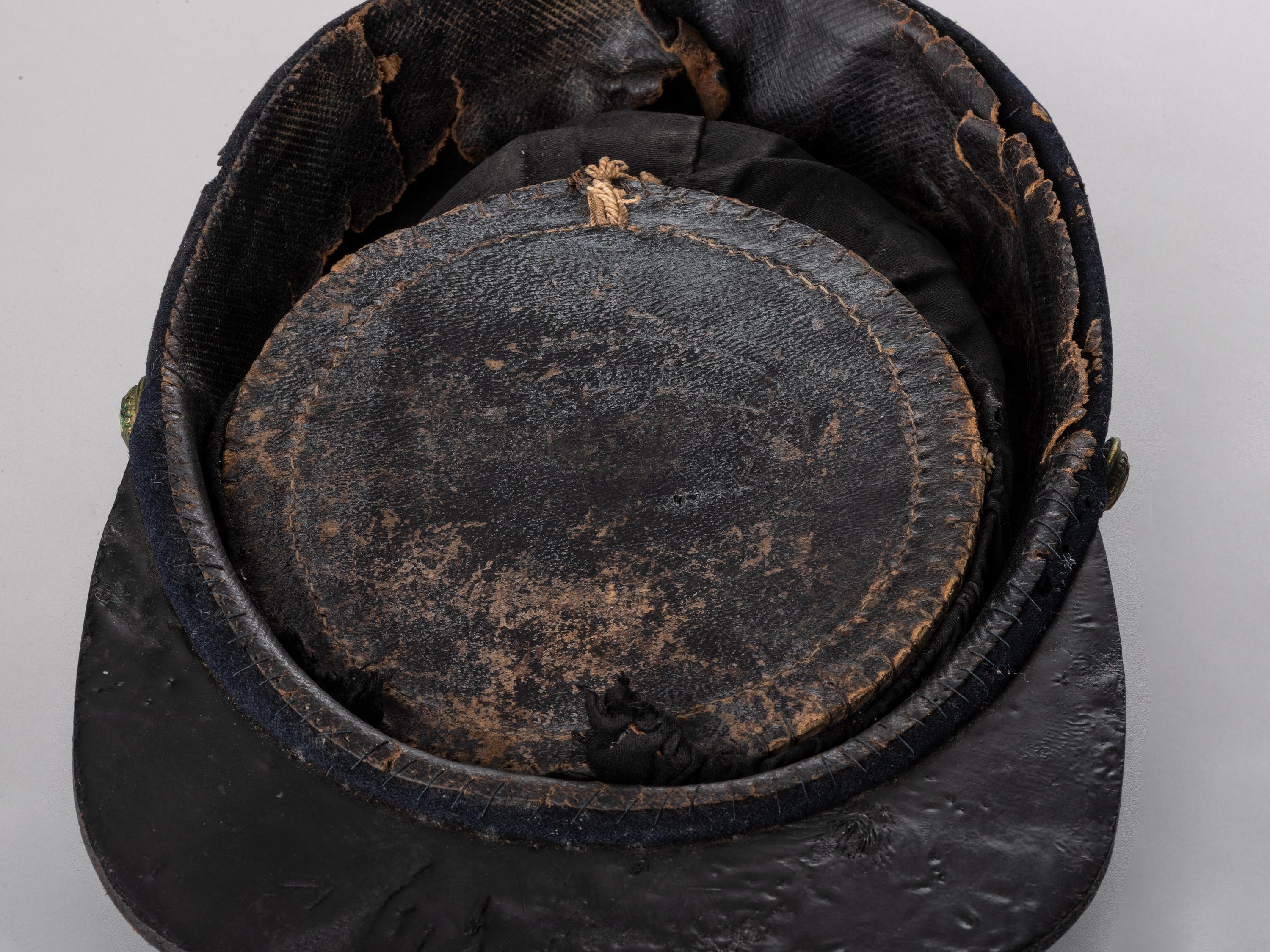 [CIVIL WAR]. Late-war 12th New York Militia kepi, manufactured by J.H. McKenney & Co., New York.