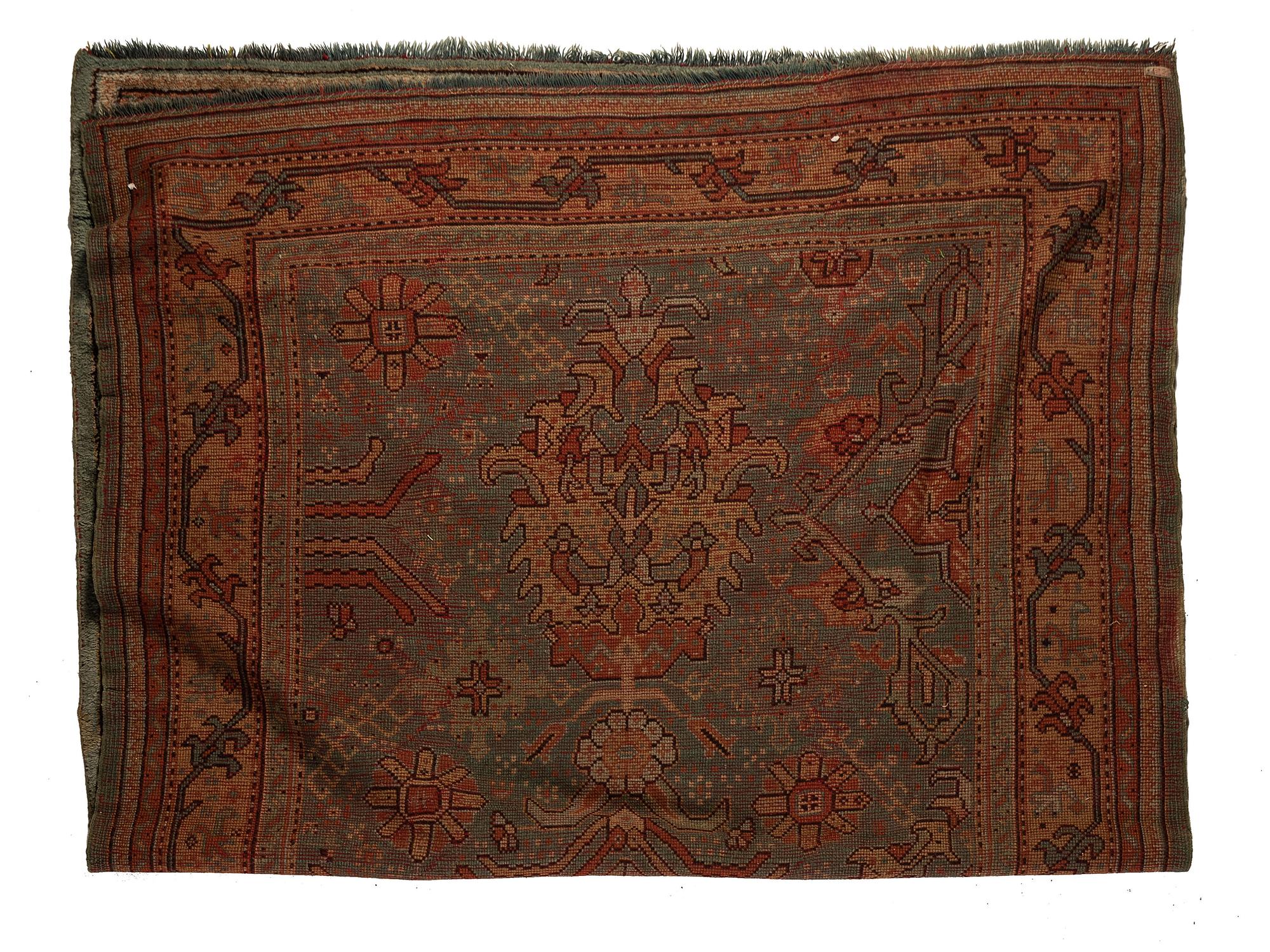 An Oushak Wool Rug