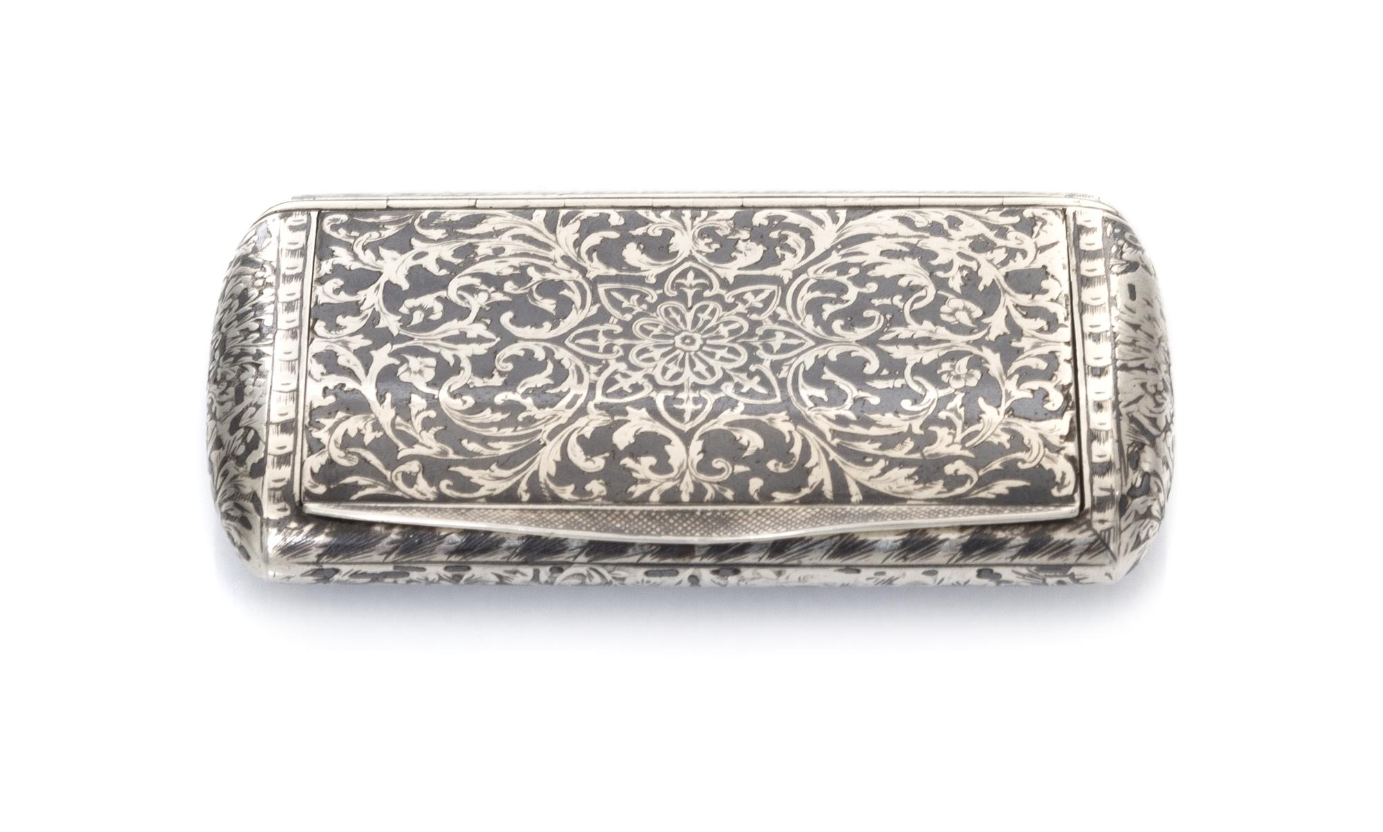 A Continental Niello Silver Cigarette Case, Marks obscured, the case decorated with floral and foliate decoration throughout, the hinge