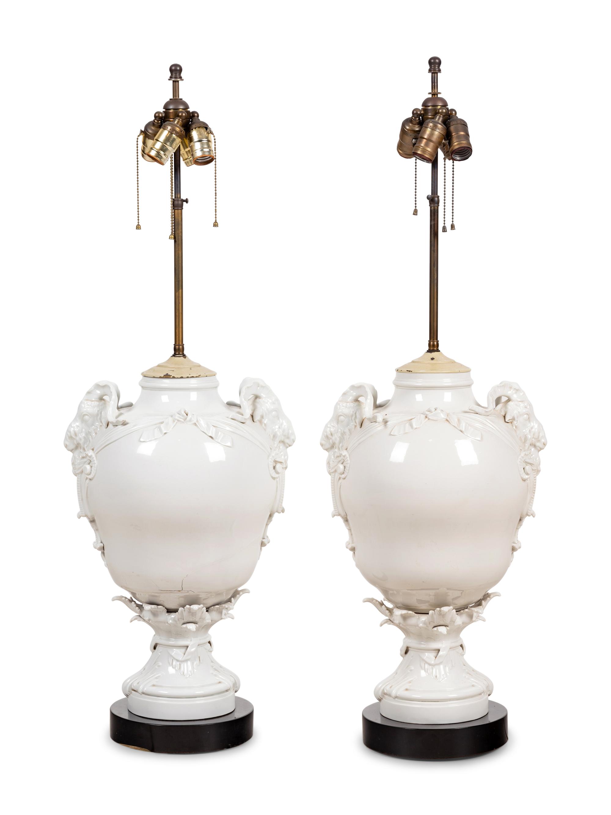 A Pair of German Blanc-de-Chine Porcelain Urns Mounted as Lamps